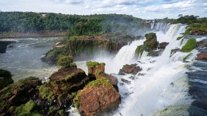 Fototapeta na wymiar Iguazu Falls around the Iguacu River on the border between Argentina and Brazil. Largest waterfalls system in the world.