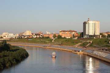 Obraz premium A boat floats along the river 