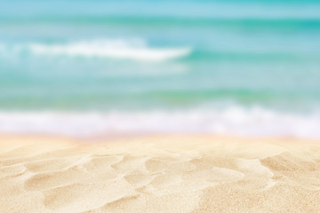 Empty sand beach in front of summer sea background with copy space