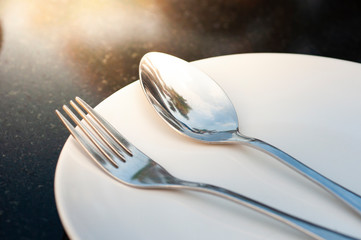 Spoon and fork on plate