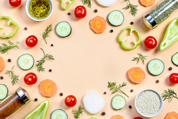 Salad ingredients layout. Food pattern with cherry tomatoes, cucumbers, greens, pepper and spices