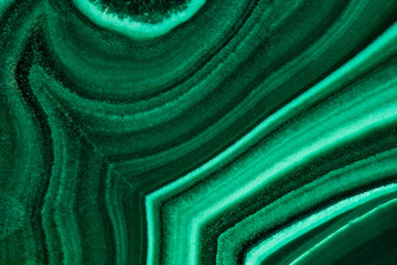 The green malachite. An ornamental stone. Photo texture. Macro.