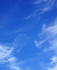 Brilliant Blue Sky with Clouds and the Moon
