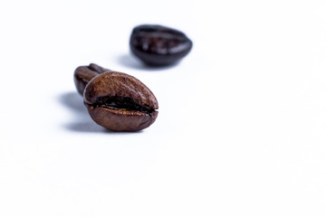 Roasted coffee beanon white