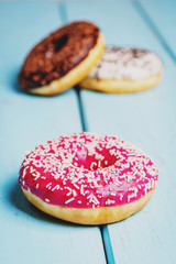 Sweet donuts on black stone table