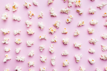 Fresh popcorn on pink background