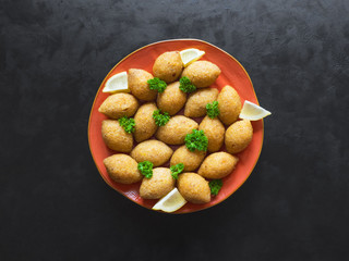 Traditional Arabic kibbeh with lamb and pine nuts