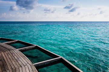 wooden balcony on the beautifully clear sea in the Maldives