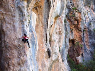 Fototapeta premium A strong rock climbing girl in Turkey, Geyikbayiri Trebenna