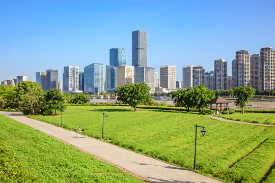 Cityscape and skyline of Fuzhou,viewed from green field in park