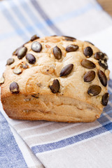 Gold rustic crusty loaves of bread and buns on wooden background. Still life captured from above top view, flat lay.