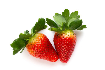 Ripe half strawberry isolated on white background.