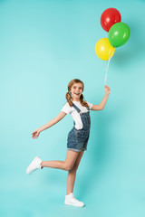 Fototapeta premium Portrait of a cheerful little girl isolated