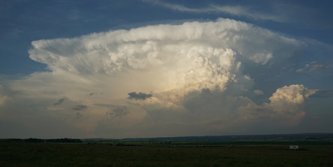 Storm clouds over vast prairies Ranches and farms bold sky powerful force of nature