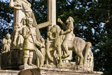 Fototapeta na wymiar Guehenno, France. The Calvary of Guehenno, dating from 1550, one of the seven great calvaries (enclos paroissial) of Brittany (Bretagne)