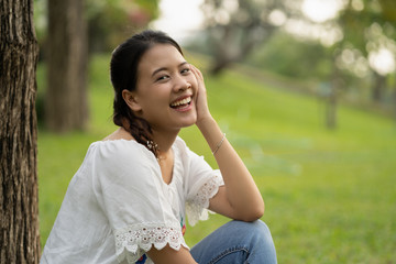 Happy Asian woman in the garden