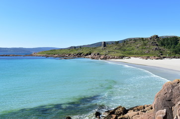Obraz premium Bay with rocks, beach and clear water. Galicia, Spain.