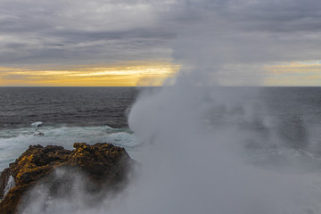 waves crashing on rocks