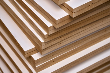 Laminated MDF bookshelves. Production of wood furniture. Furniture manufacture. Close-up - obrazy, fototapety, plakaty