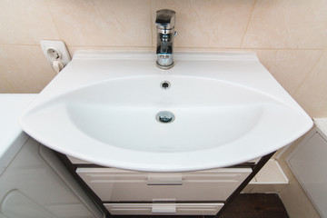 The photo of a sink in a bathroom