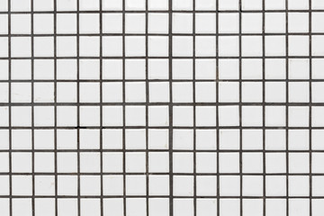 White dirty ceramic tiles wall or floor for background texture.