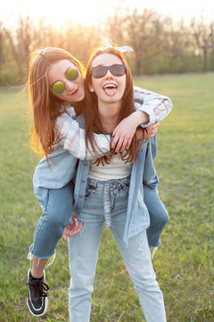 Two young women having fun outdoors. Best friends