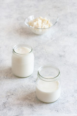 Fermented drink kefir in small bottles and kefir grains