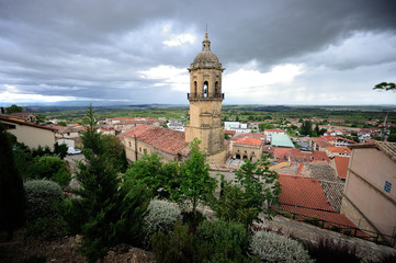 Obraz premium Labastida, Alava (Basque Country)/Spain; 06-29-2019: street of the medial or old helmet, paved floor and church is that of Our Lady of the Assumption