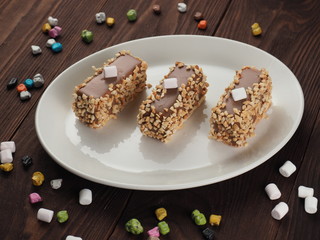 Chocolate cake sprinkled with nuts