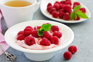 Creamy curd mousse with raspberries. Healthy breakfast.