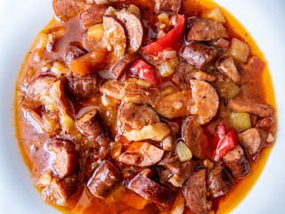 Ketogenic meal, fat Letcho with sausage, bacon, pepper and tomato