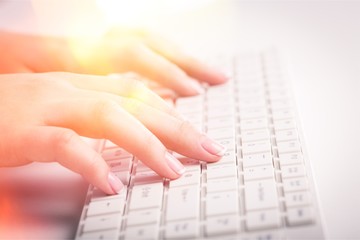 Woman typing computer.