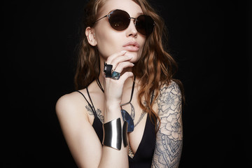 tattooed girl in underwear, sunglasses and jewelry