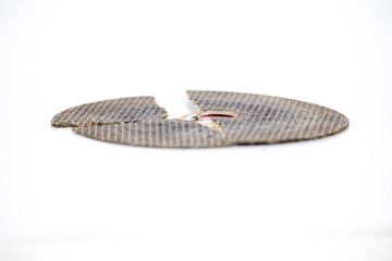 broken cracked cutting wheels abrasive disc isolated white background photo close up side view