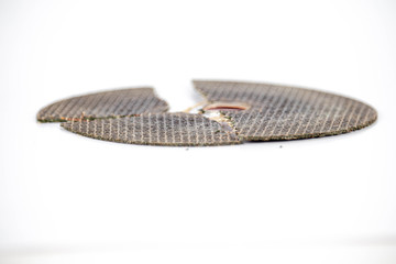 broken cracked cutting wheels abrasive disc isolated white background photo close up side view