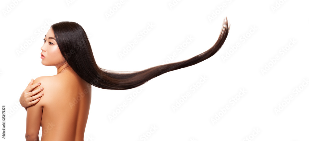 Wall mural Asia Model throws your perfect long hair. Long hair girl happy girl throws up her hair. White background.  studio shot. - Image .    