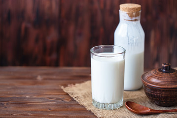 Homemade kefir, yogurt with probiotics in a glass on table Probiotic cold fermented dairy drink Trendy food and drink Copy space Rustic style.