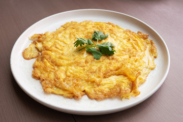 omelette, scrambled on white plate - it is simple food easy to cooking for meal