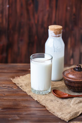 Homemade kefir, yogurt with probiotics in a glass on table Probiotic cold fermented dairy drink Trendy food and drink Copy space Rustic style.
