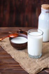 Homemade kefir, yogurt with probiotics in a glass on table Probiotic cold fermented dairy drink Trendy food and drink Copy space Rustic style.
