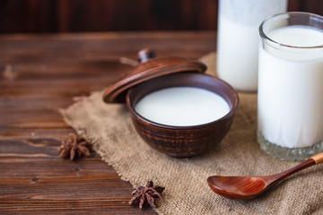 Homemade yogurt in a cup, a glass of kefir with probiotics Probiotic cold fermented dairy drink Trendy food and drink Copy space Rustic style.