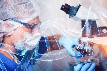 Young female scientist standing in her lab.