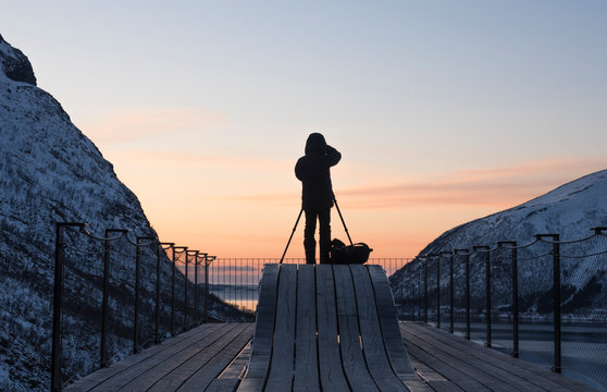 A photographer shooting a fjord in Norway