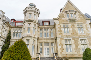 Fototapeta na wymiar College, Palacio de la Magdalena in the city of Santander, north of Spain. Building of eclectic architecture and English influence next to the Cantabrian Sea