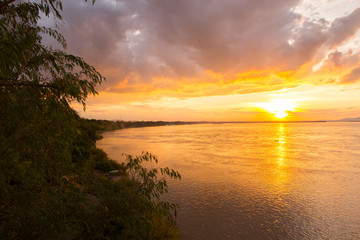 Naklejka na ściany i meble Mekong River in Pakse, South of Laos against sunset