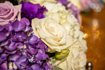 A bouquet of of white and purple colored flowers