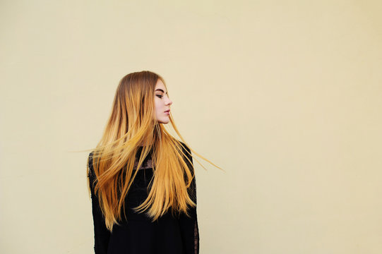 The blonde girl model posing in studio