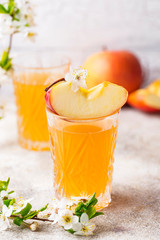 Glasses with fresh apple juice or cider