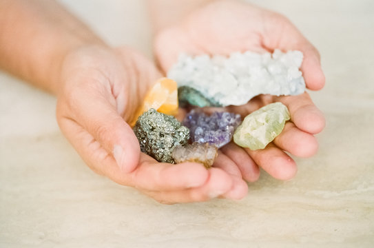 Female hands holding crystals