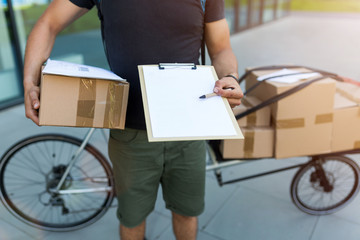 Bicycle messenger making a delivery on a cargo bike